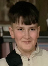 A child with short hair and bangs

AI-generated content may be incorrect.